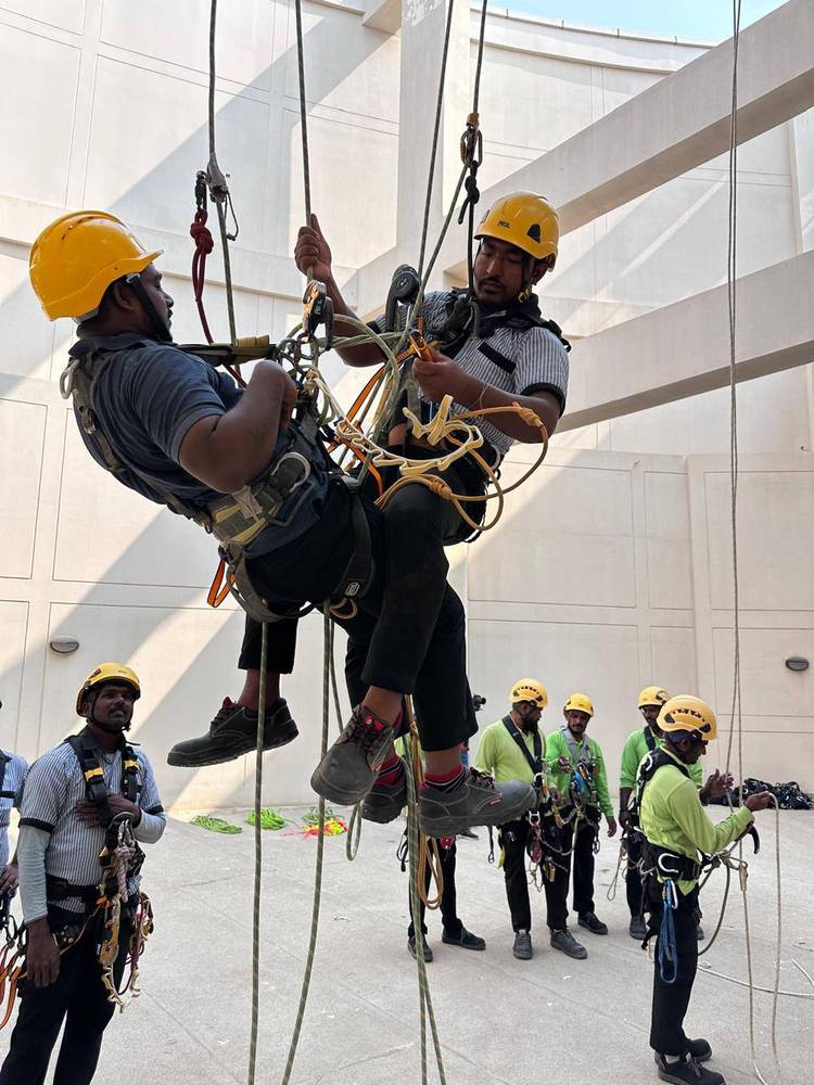 A suspended pick-off rescue demonstrated to a class of technicians in harnesses